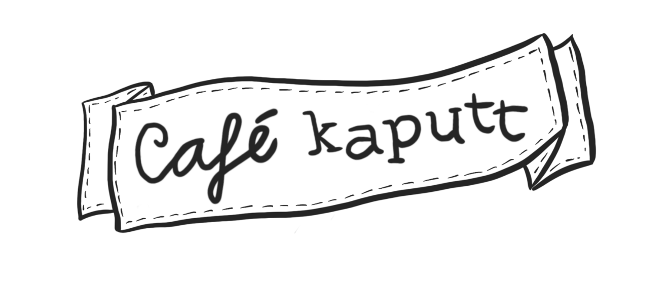 Schwarz-weißes Banner auf dem steht "Café kaputt"